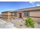 Single-story home with covered entry, stone walkway, desert landscaping, and neutral stucco at 7910 Pandora Sky St # 271, North Las Vegas, NV 89084