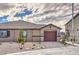 Charming single-story home with a well-manicured front yard and a two-car garage at 7910 Pandora Sky St # 271, North Las Vegas, NV 89084