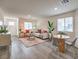 Bright living area featuring wood floors, stylish furnishings, and plenty of natural light at 7910 Pandora Sky St # 271, North Las Vegas, NV 89084