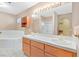 Bathroom featuring double sinks, tub, and shower at 880 Autumn Canyon Way, Henderson, NV 89002