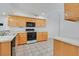 Classic kitchen features a gas range, built in microwave, tile backsplash, and tile floor at 880 Autumn Canyon Way, Henderson, NV 89002