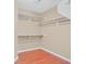 Walk-in closet with shelving and wood floors at 880 Autumn Canyon Way, Henderson, NV 89002