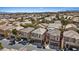 A high-density neighborhood showcasing two-story homes with desert landscaping, attached garages, and tile roofs at 9153 Beauchamp Ave, Las Vegas, NV 89148