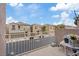 Patio overlooking neighborhood, white metal fence, and view of the street at 9153 Beauchamp Ave, Las Vegas, NV 89148