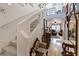 A well-lit foyer with a staircase and open view to the living room showcases the home's layout at 9153 Beauchamp Ave, Las Vegas, NV 89148