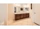 Bathroom featuring a double sink vanity with wood cabinets and tile flooring at 917 Pigeon Forge Ave, Henderson, NV 89015