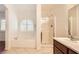 Bathroom featuring a soaking tub and a separate glass-enclosed shower at 917 Pigeon Forge Ave, Henderson, NV 89015