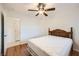 Bedroom with wood floor and door leading to bathroom at 917 Pigeon Forge Ave, Henderson, NV 89015