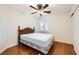 Bedroom with ceiling fan, shuttered windows, and wood floors at 917 Pigeon Forge Ave, Henderson, NV 89015