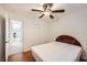 Bedroom featuring wood floors, closet and bright light from the window with shuttered blinds at 917 Pigeon Forge Ave, Henderson, NV 89015