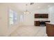 Inviting dining nook bathed in natural light, complemented by modern appliances and sleek countertops in the kitchen at 917 Pigeon Forge Ave, Henderson, NV 89015
