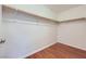 Walk-in closet with wood floor and white walls and shelving at 917 Pigeon Forge Ave, Henderson, NV 89015