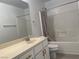 Clean bathroom featuring a shower-tub combo and a single sink vanity at 953 Via Gandalfi, Henderson, NV 89011