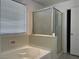 Bathroom with shower stall, garden tub, and large window with privacy blinds at 953 Via Gandalfi, Henderson, NV 89011