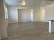 Spacious living room with light wood flooring and an open floor plan at 953 Via Gandalfi, Henderson, NV 89011