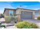 Charming single-story home with a two-car garage, well-maintained landscaping, and a welcoming front entrance at 9739 Douglas Fir St, Las Vegas, NV 89143