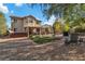 Large backyard featuring multiple seating areas, mature trees, and an outdoor hot tub at 9768 Northern Dancer Dr, Las Vegas, NV 89117