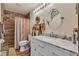 Stylish bathroom with a marble countertop vanity and walk-in shower with modern fixtures at 9768 Northern Dancer Dr, Las Vegas, NV 89117