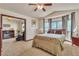 Comfortable bedroom with carpet and connected living room at 9768 Northern Dancer Dr, Las Vegas, NV 89117