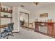 Bedroom featuring built in desk, fireplace and sliding mirror closet at 9768 Northern Dancer Dr, Las Vegas, NV 89117