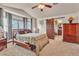 Bedroom featuring carpet, ensuite bathroom, and ample natural light at 9768 Northern Dancer Dr, Las Vegas, NV 89117