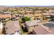 An aerial view of multiple houses in a developed community showing neighborhood features at 9807 Sage Canyon St, Las Vegas, NV 89178