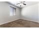 Bedroom featuring neutral paint, carpet flooring, window with blinds, and ceiling fan at 9807 Sage Canyon St, Las Vegas, NV 89178