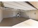 Spacious two car garage featuring a sealed floor and installed shelving at 9807 Sage Canyon St, Las Vegas, NV 89178