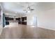 Open-concept living room showcases dark cabinets, granite countertops, and tile flooring throughout the home at 9807 Sage Canyon St, Las Vegas, NV 89178