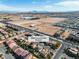 This aerial view captures a desert landscape and the property's proximity to city amenities and desert expanse at 9967 Pipestone St, Las Vegas, NV 89141