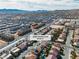 This aerial showcases a neighborhood with mountain views, highlighting community living and nearby amenities at 9967 Pipestone St, Las Vegas, NV 89141
