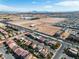 This aerial view captures a desert landscape and the property's proximity to city amenities and desert expanse at 9967 Pipestone St, Las Vegas, NV 89141