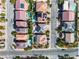 Aerial view shows rooftops and streets lined with homes with solar panels and swimming pools at 9967 Pipestone St, Las Vegas, NV 89141