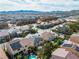 This aerial view shows many houses with pools and solar panels in a well-planned residential community at 9967 Pipestone St, Las Vegas, NV 89141