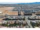 This aerial view showcases a residential area near the South Point Casino and mountains in the distance at 9967 Pipestone St, Las Vegas, NV 89141