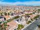 Expansive aerial view of a residential neighborhood showcasing diverse home styles and mountain views at 9967 Pipestone St, Las Vegas, NV 89141