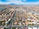 Neighborhood aerial with labeled 9967 Pipestone Street featuring rooftops, landscaping, and mountain views at 9967 Pipestone St, Las Vegas, NV 89141