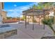 Spacious backyard with a built-in sink, sink, and covered gazebo, perfect for outdoor entertaining and relaxation at 9967 Pipestone St, Las Vegas, NV 89141