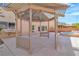 Relaxing backyard featuring a charming gazebo with string lights, perfect for outdoor gatherings and entertainment at 9967 Pipestone St, Las Vegas, NV 89141