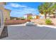 Expansive backyard featuring a central water feature, covered gazebo, and ample space for outdoor activities at 9967 Pipestone St, Las Vegas, NV 89141