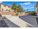 Well-designed backyard with a central water feature, covered gazebo, and potential for versatile landscaping at 9967 Pipestone St, Las Vegas, NV 89141