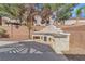Outdoor kitchen with counter and storage provides space for entertaining and enjoying the backyard landscape at 9967 Pipestone St, Las Vegas, NV 89141