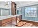 Bathroom featuring double sinks, vanities, and natural light at 9967 Pipestone St, Las Vegas, NV 89141