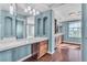 Bathroom featuring blue-striped walls, vanity, and hardwood floors at 9967 Pipestone St, Las Vegas, NV 89141