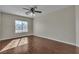 Bedroom with a ceiling fan and wood-look flooring at 9967 Pipestone St, Las Vegas, NV 89141