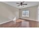 Bedroom with a ceiling fan and wood-look flooring at 9967 Pipestone St, Las Vegas, NV 89141