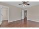 Bedroom features a ceiling fan, a walk in closet and wood-look flooring at 9967 Pipestone St, Las Vegas, NV 89141