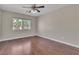 Bedroom with a ceiling fan and wood-look flooring at 9967 Pipestone St, Las Vegas, NV 89141