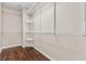 Walk-in closet with metal shelving and hardwood floors. Perfect for storage and organization at 9967 Pipestone St, Las Vegas, NV 89141