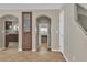 Hallway with tile floors provides access to the kitchen, bathroom, and stairway at 9967 Pipestone St, Las Vegas, NV 89141